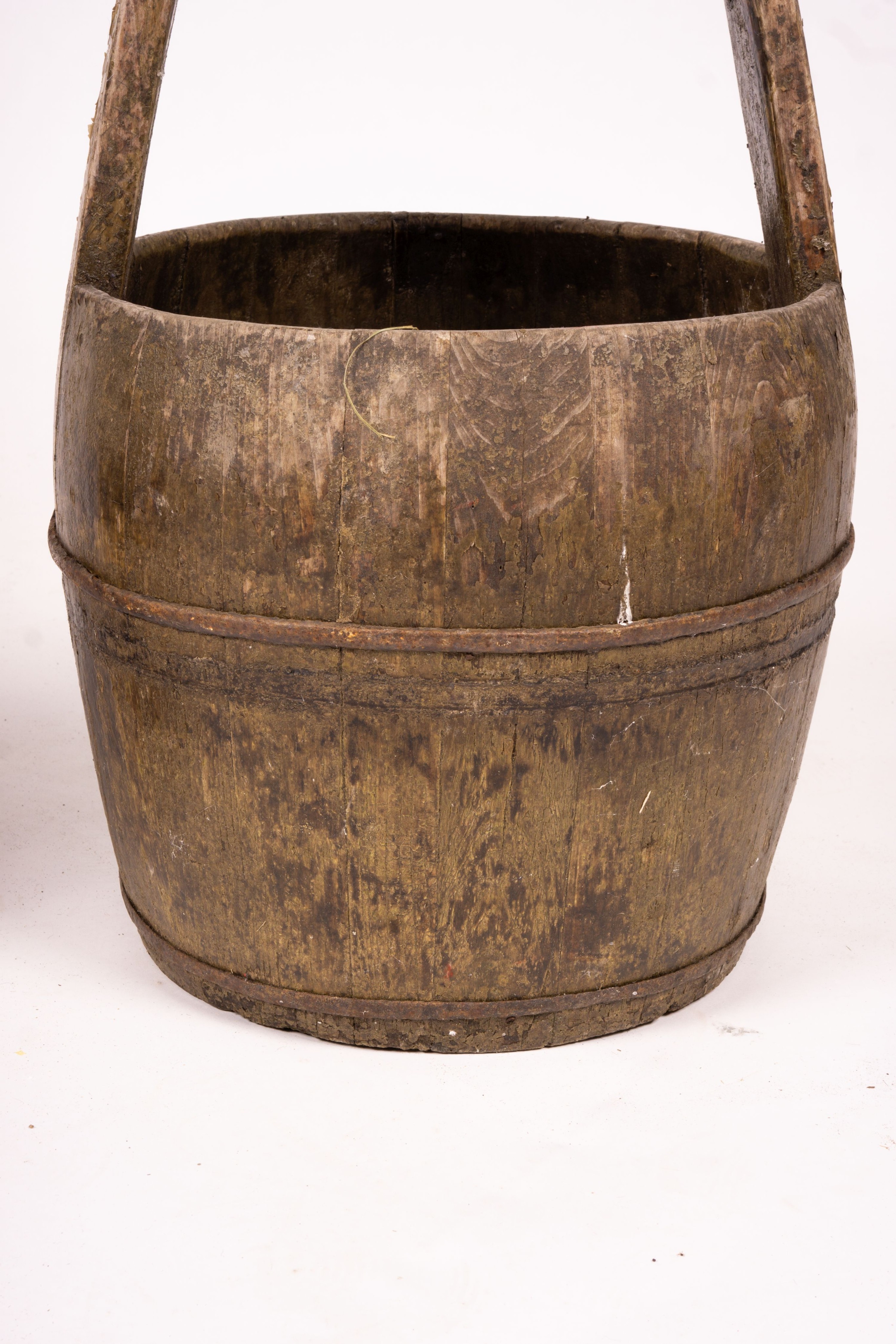 A Chinese staved wood rice carrier together with a circular iron bound staved wood bucket, larger 35cm diameter, height 52cm